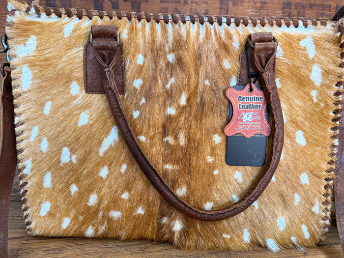 Deer-spotted cowhide briefcase tote front panel with stitched edges and leather handles
