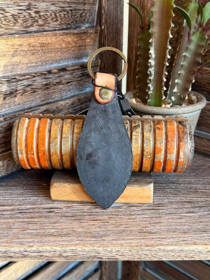 Dark leather keychain with metal key ring and small snap/rivet tab