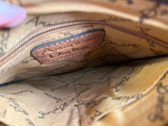 Coin crossbody purse interior lining with printed text and stitched seams