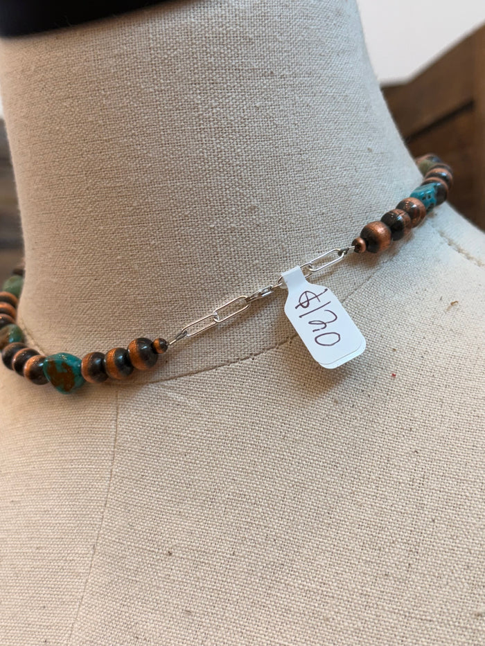 Turquoise and copper bead necklace with clasp and small price tag detail