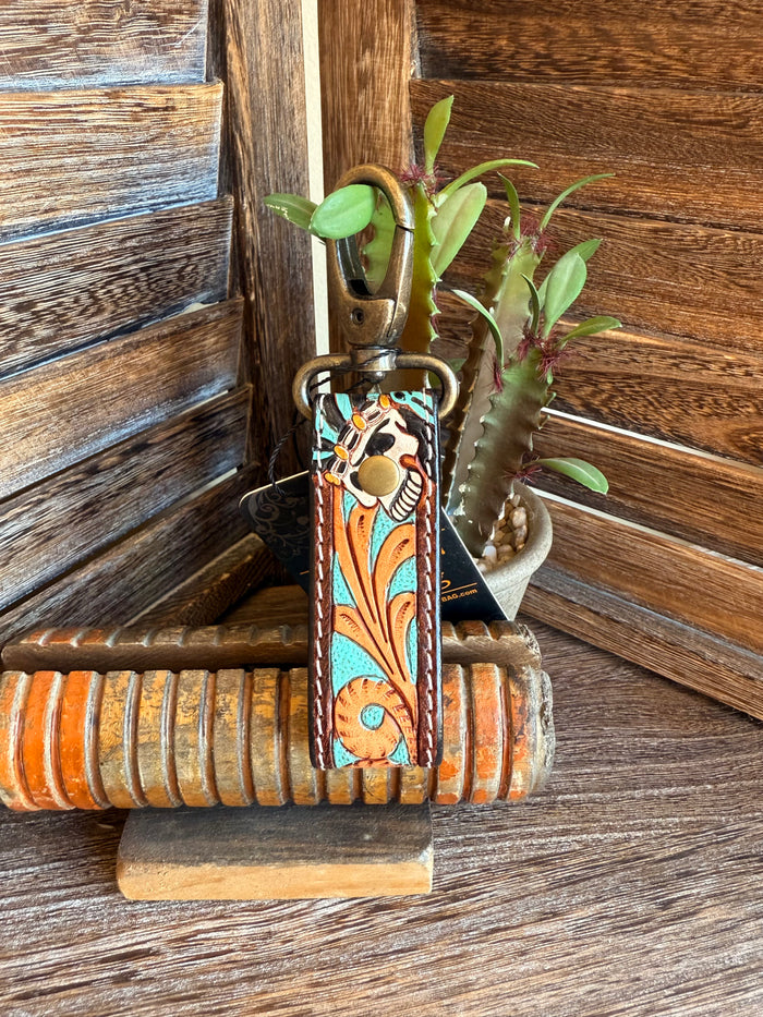 Turquoise tooled leather keychain with owl patch and brass clip, floral border