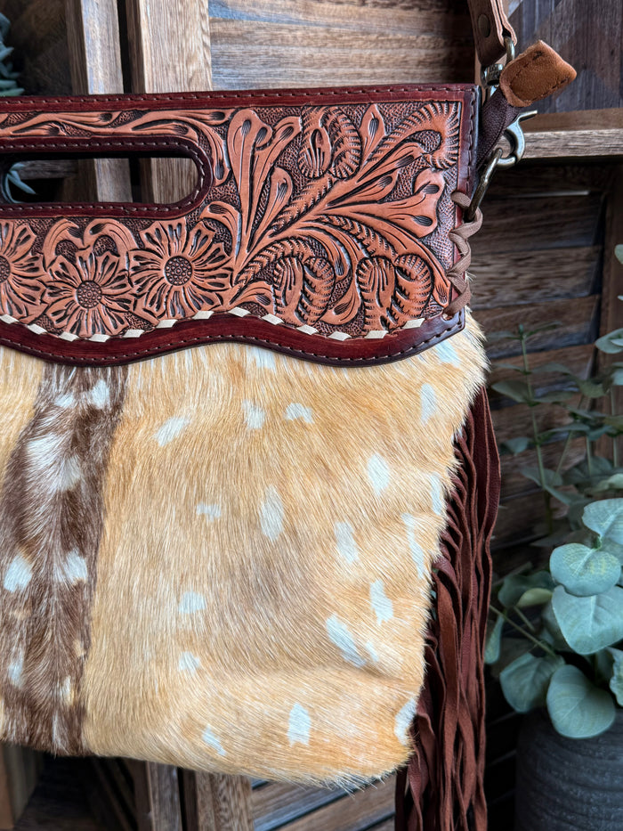 Cowhide deer print crossbody purse with floral tooled top and brown fringe detail
