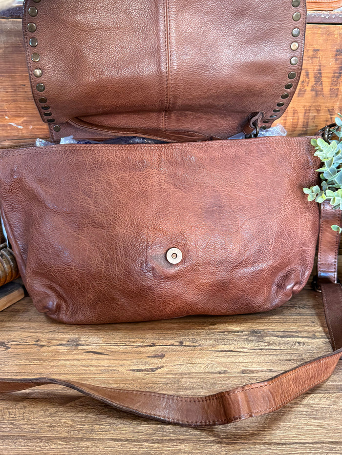 Chocolate leather small crossbody purse with front flap and metal button closure