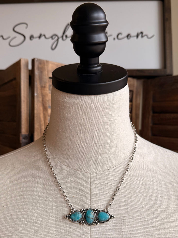 Turquoise triple-stone bar pendant necklace with three oval stones on silver chain