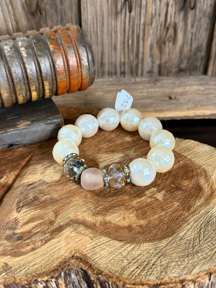 Opal-like bead stretch bracelet with rose quartz center and crystal accents