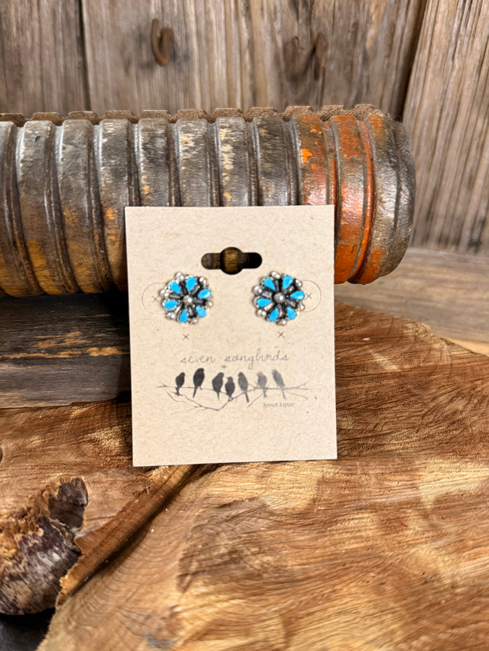 Turquoise blue flower stud earrings with silver-tone metal and faceted center