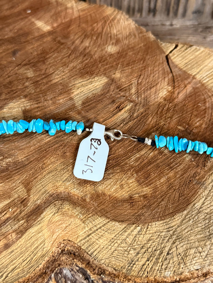 Turquoise chip bead necklace with silver clasp and hanging tag