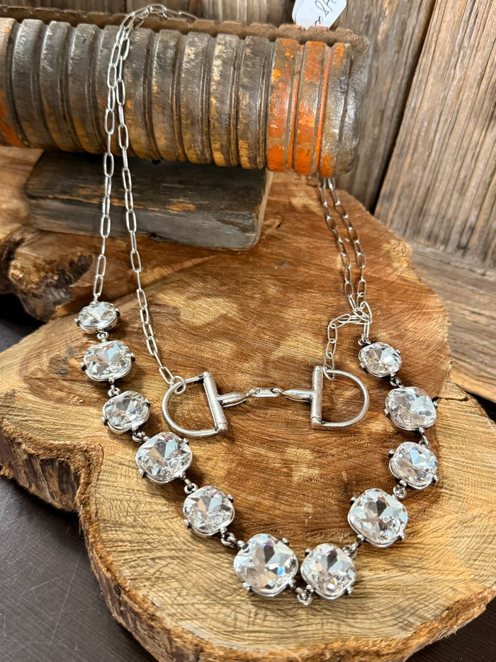 Layered crystal necklace with heart toggle clasp and dangling round faceted charms