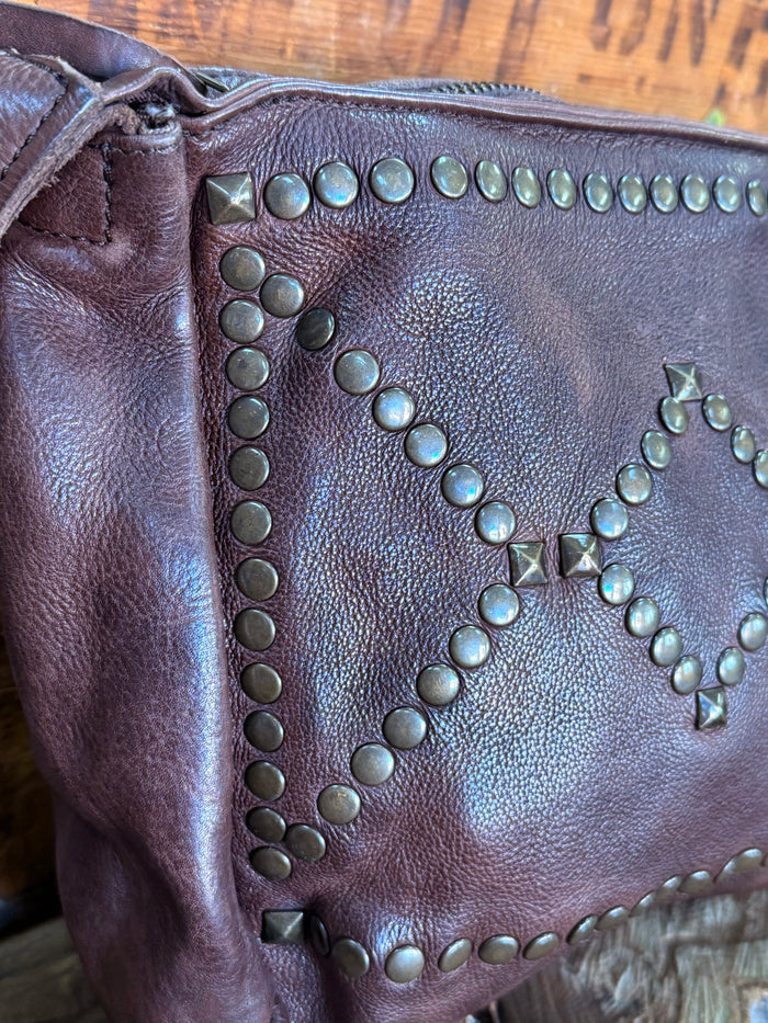 Chocolate brown studded zip-top crossbody purse close-up of star-shaped bead design