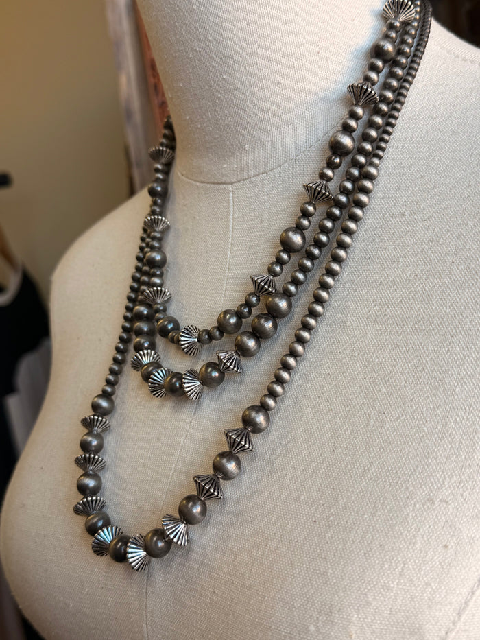 Silver pearl rondelle necklace side view with layered bead strands