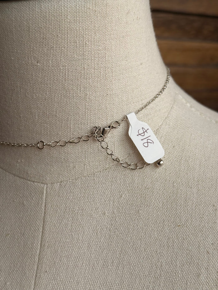 Silver-tone necklace chain with lobster clasp and attached small brand tag