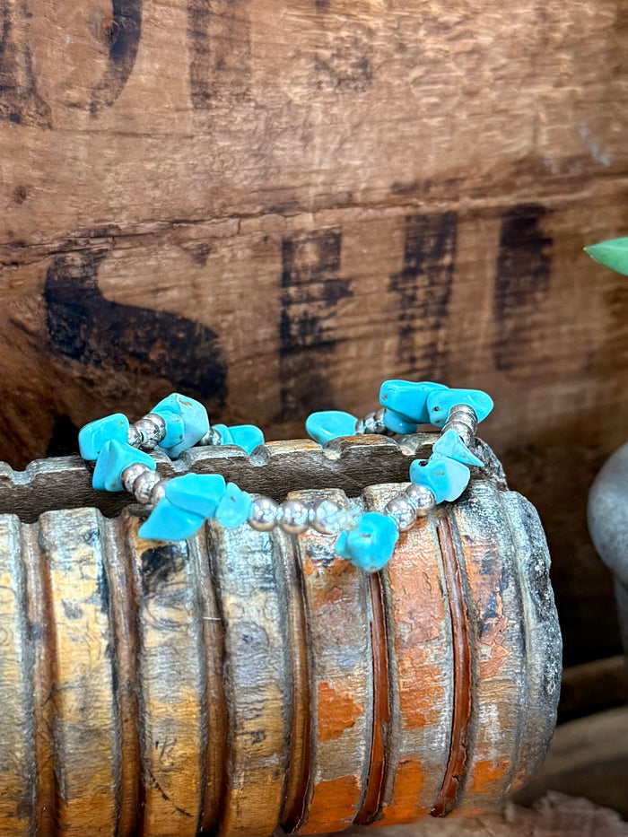 Turquoise chip stretch bracelet with silver bead spacers on elastic band