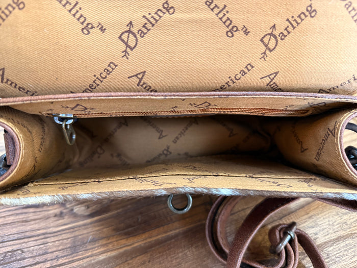 Mini crossbody purse interior lining with printed text and strap grommets