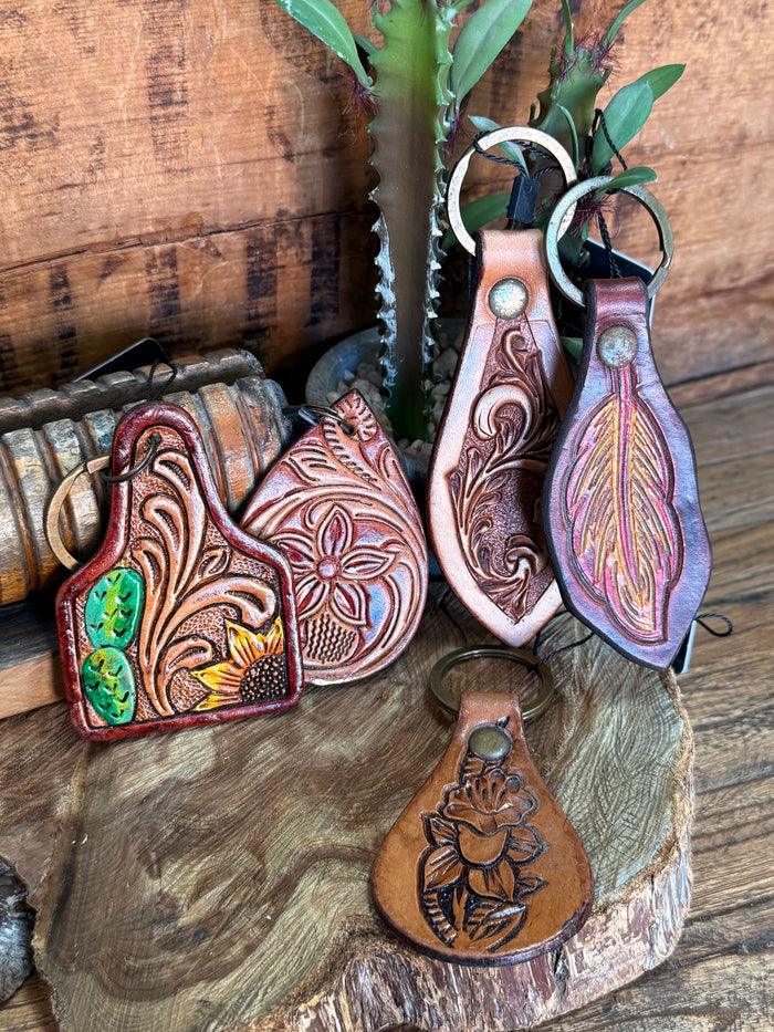 Carved cowhide leather key fobs with metal rings, decorative floral and cactus tooling