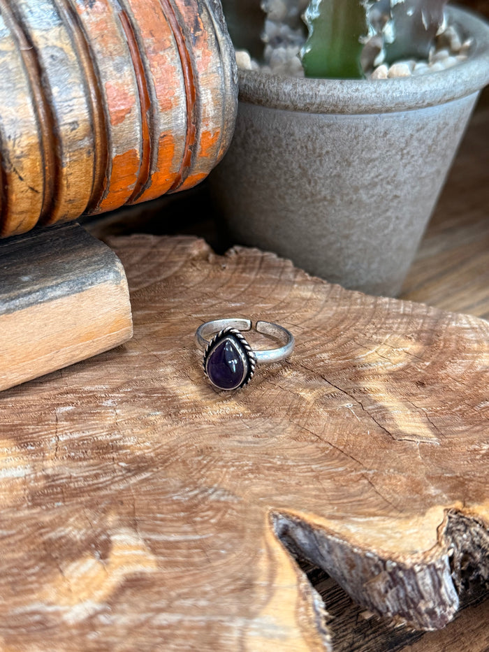Silver-tone adjustable ring with oval deep purple natural stone bezel