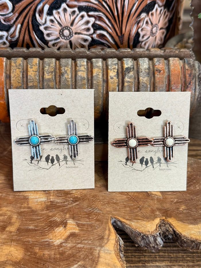 Zia symbol stud earrings with turquoise and red stones; cactus and ladder charms on cards