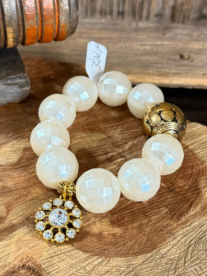 Pearl gold crystal charm stretch bracelet, round white beads with gold floral crystal pendant