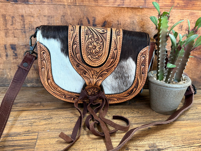Tooling hair-on mini crossbody bag, black/white cowhide with brown leather strap