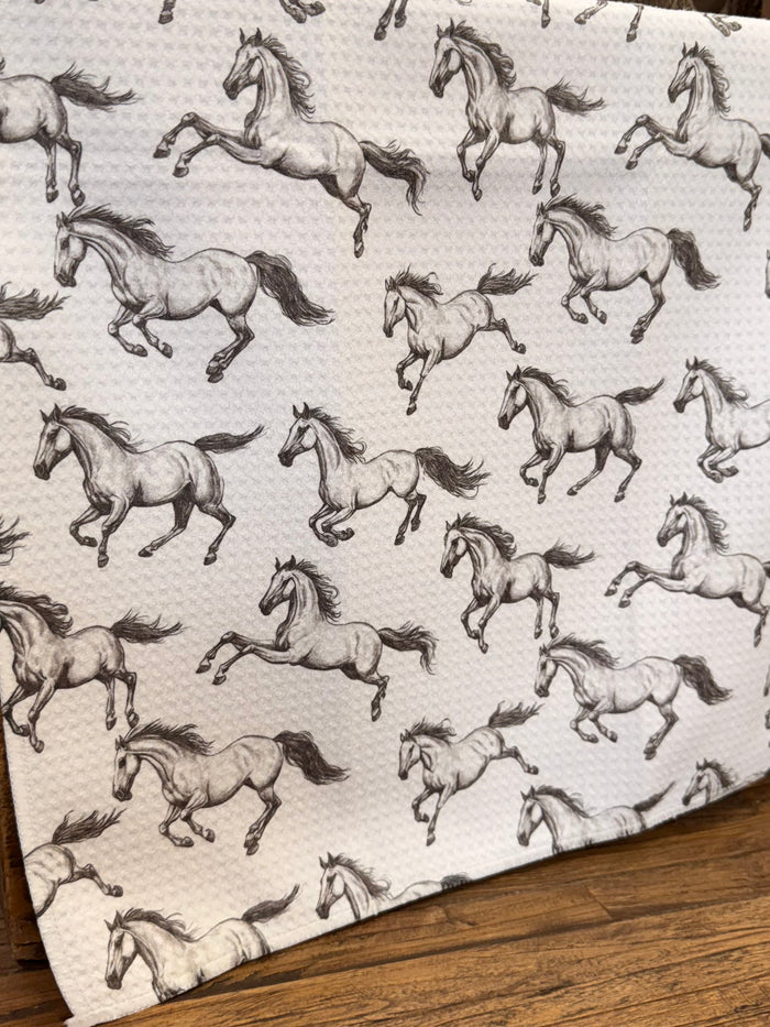 Running horses pattern towel, black horse silhouettes on white waffle fabric