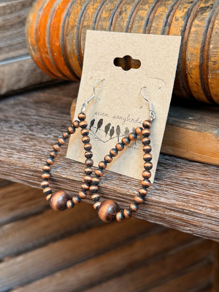 Copper beaded teardrop earrings with stacked hoops and round bronze drop charms