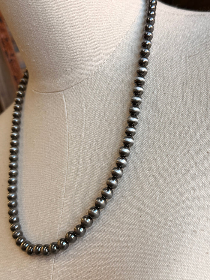 Close-up of an 8mm silver ball chain necklace with round bead links