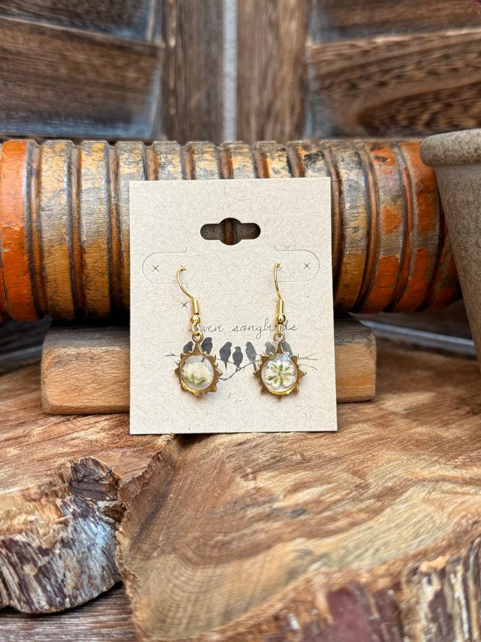 Gold-tone fishhook earrings with pale green dried flower resin dangles