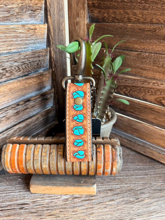 Brown tooled leather keychain with turquoise stone inlays and metal key ring