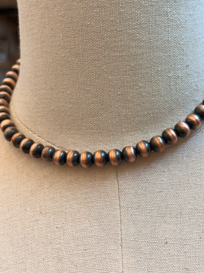 Close-up of 8mm copper-tone beads necklace