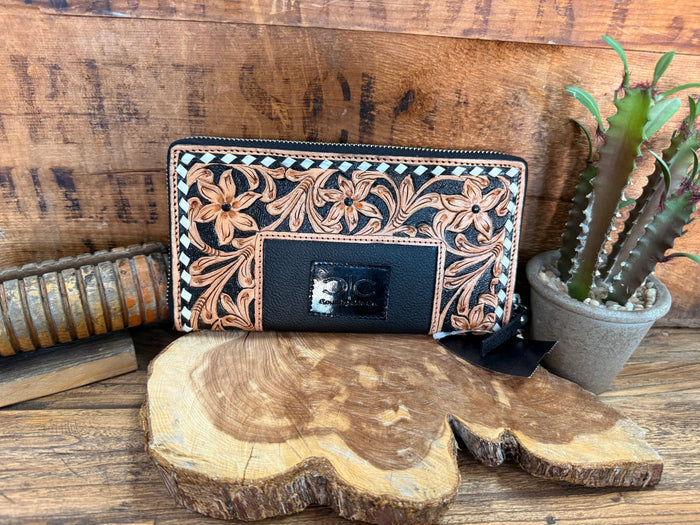 Floral tooled leather wristlet wallet with dark front panel and small logo patch