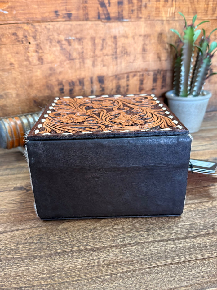 Hair-on jewelry box with black leather sides and carved brown lid