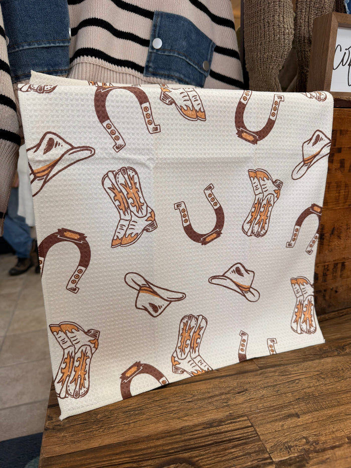 Cowboy boots and hats patterned towel, white with brown and orange prints