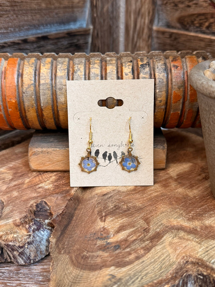 Gold-tone fishhook earrings with blue flower drop charms