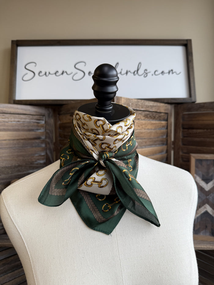 Green wild rag scarf tied in front bow with gold snaffle bit design