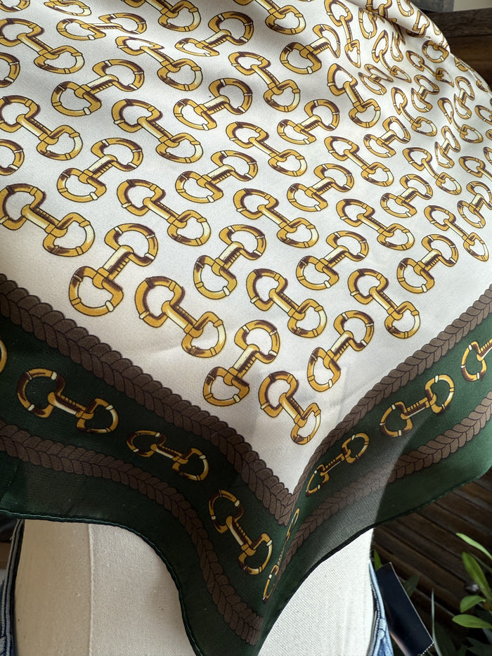 Green wild rag scarf with gold snaffle bit pattern and dark braided edge trim