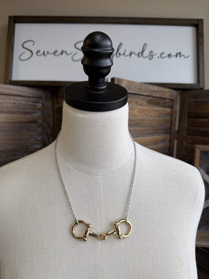 Snaffle bit necklace with gold-tone D-ring charms and silver-tone link chain