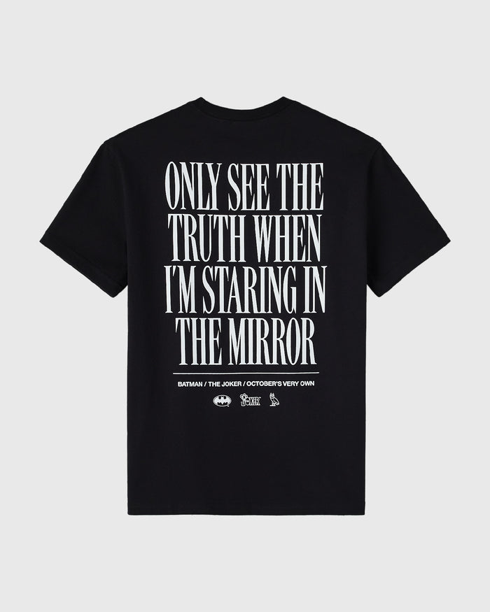 Black t-shirt with white text reading "Only See the Truth When I'm Staring in the Mirror" and Batman/Joker logos below.
