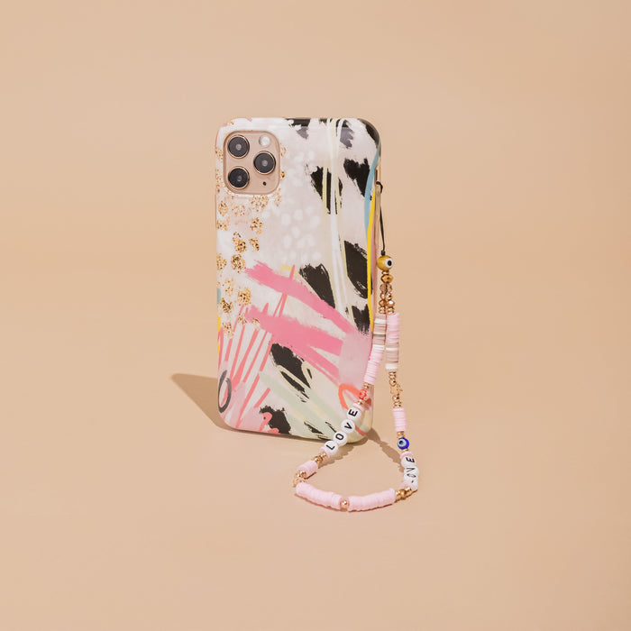Beige phone case with Coconut Lanes beaded strap, colorful beads, and the word LOVE in white letters.