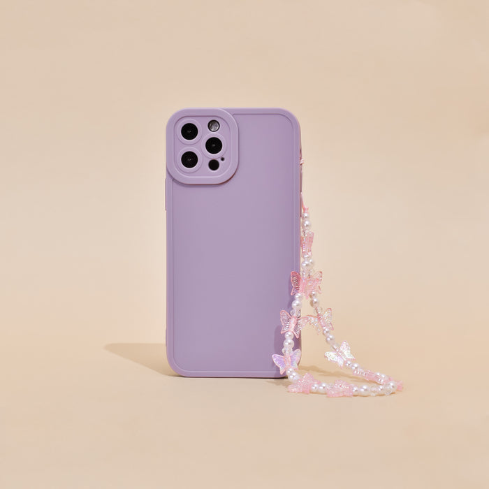 Lavender phone case with a holographic butterfly beaded strap on a beige background.