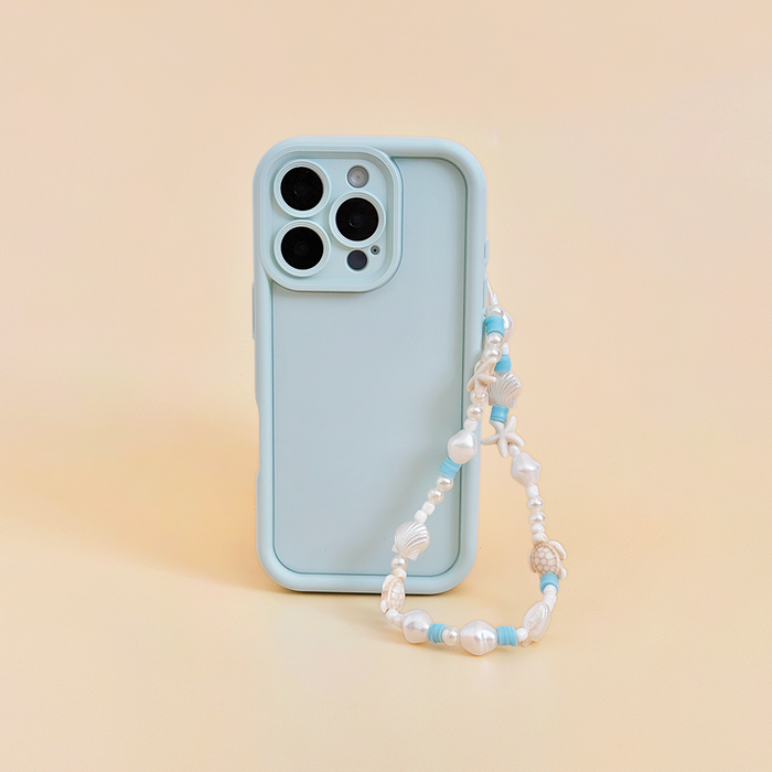 Beaded phone strap with blue and colorful beads attached to a light blue case on a peach background.