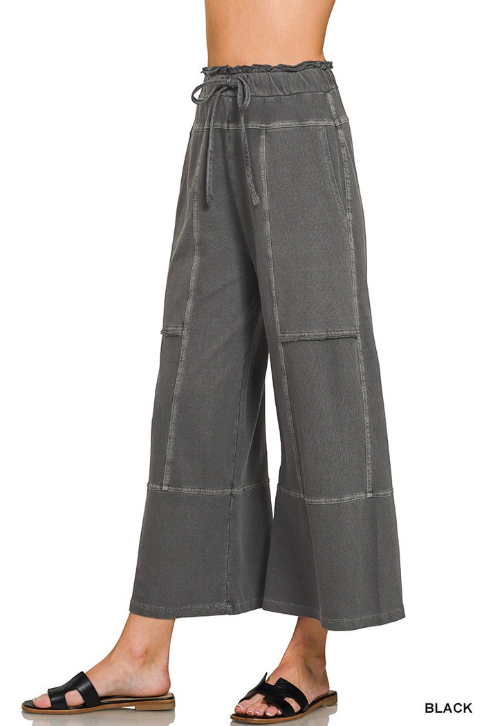 Dark charcoal seamed cotton sweatpants with drawstring waist and wide-leg hem