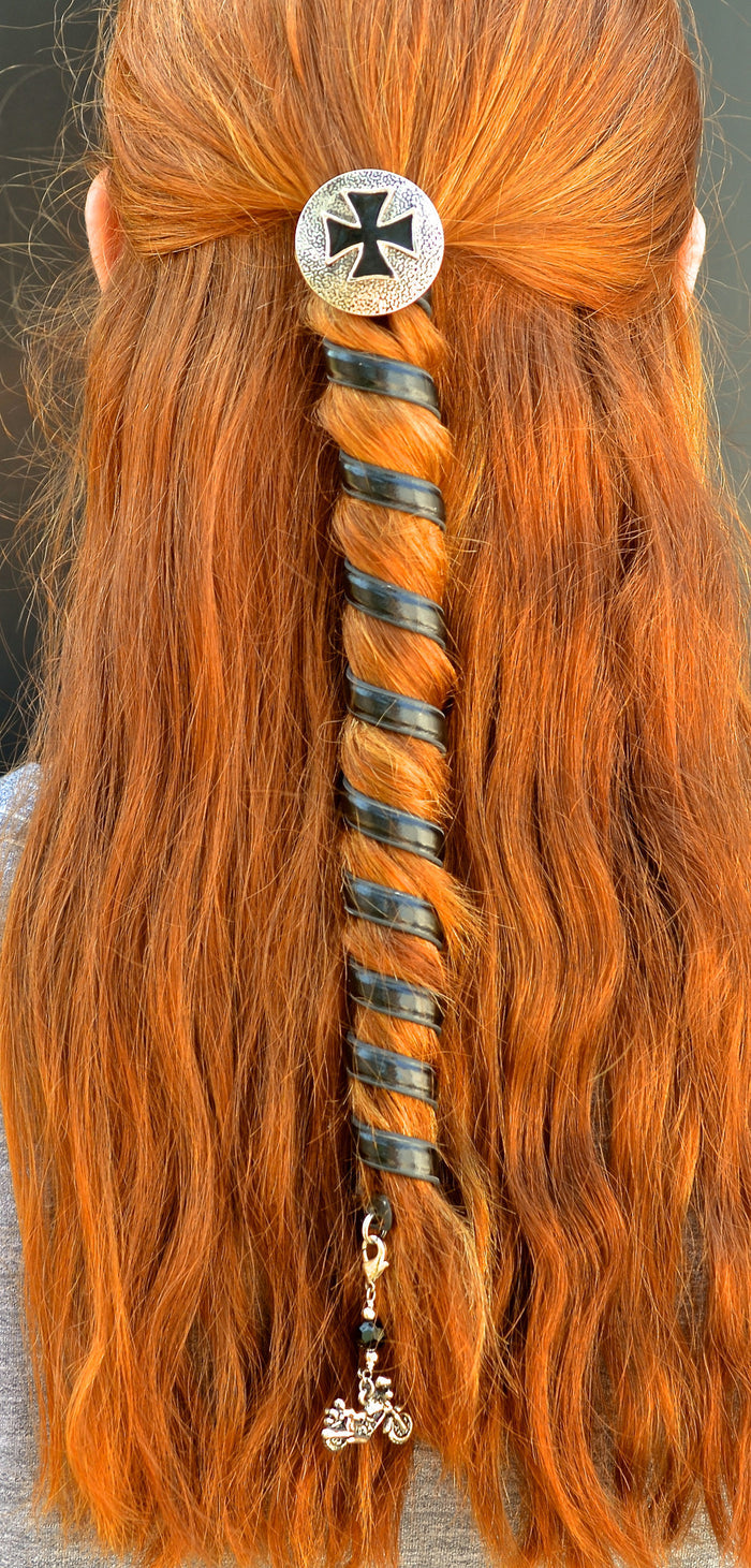 12-inch black leather biker ponytail holder worn by model, featuring a spiral wrap design and Celtic hammer charm on long red hair, back view.