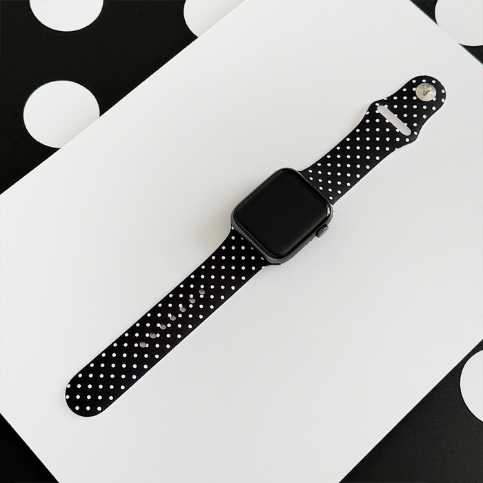 Black Apple Watch strap with white polka dot pattern from Coconut Lane.