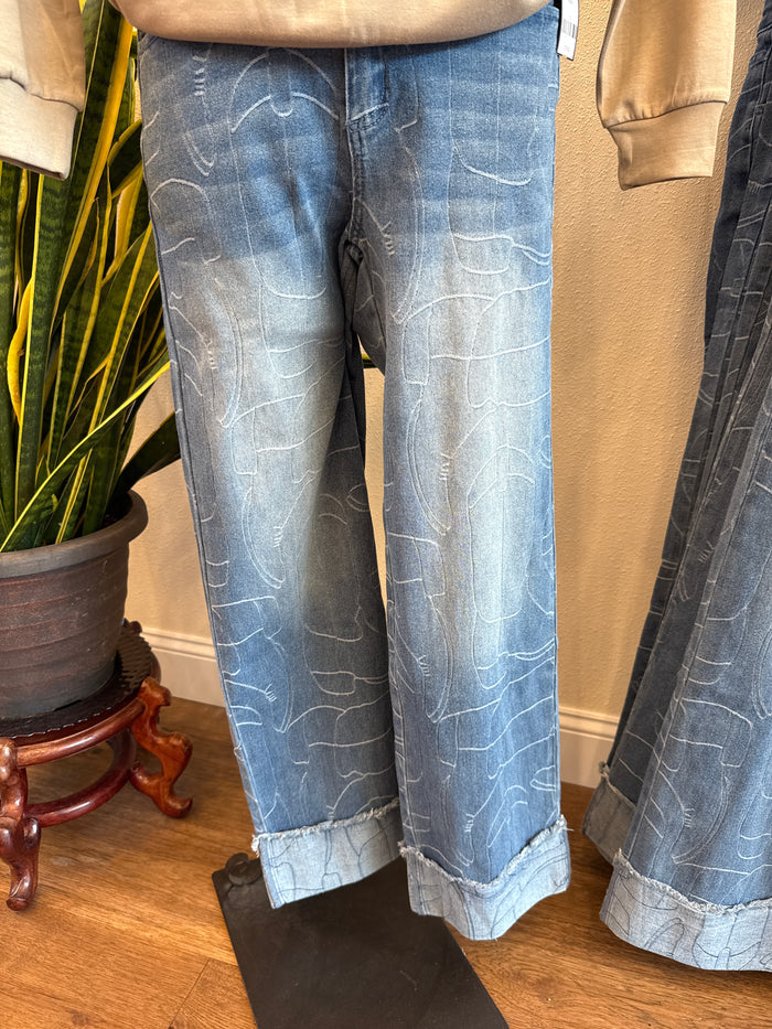 Light blue stitched cuffed jeans with allover stitched line pattern, straight leg