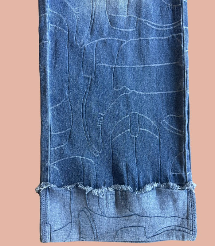 Light blue cuffed denim jeans with stitched pattern and frayed cuff hem