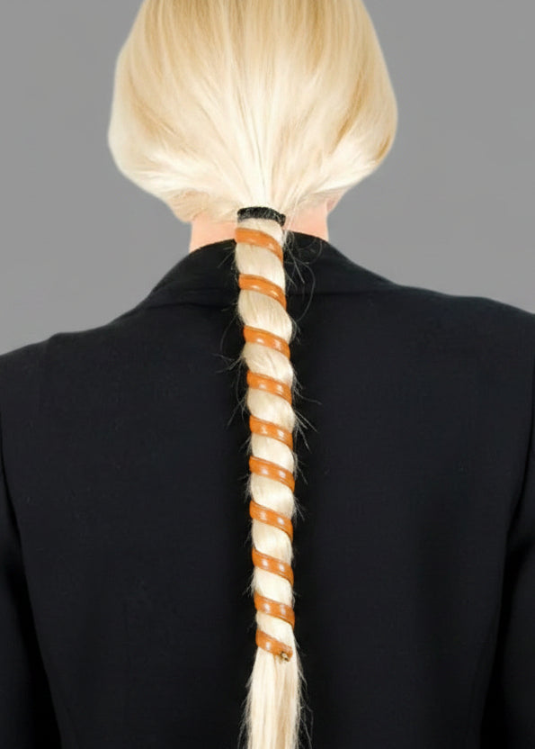 Model wearing brown leather spiral ponytail wrap hair accessory, 12-inch, back view