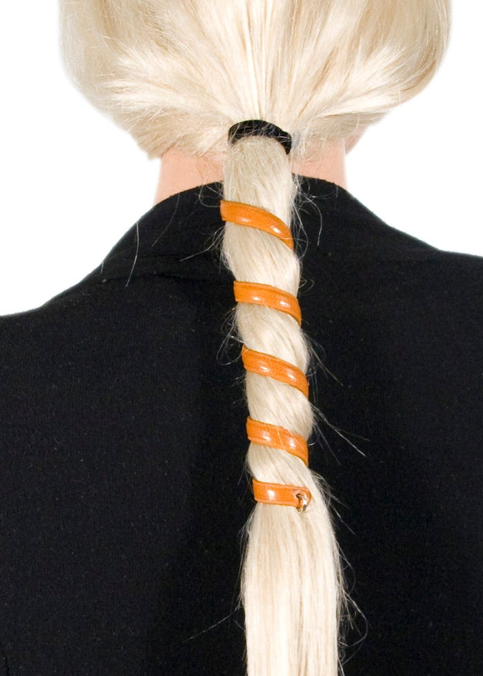 Model wearing brown leather spiral ponytail wrap hair accessory, 6-inch, back view