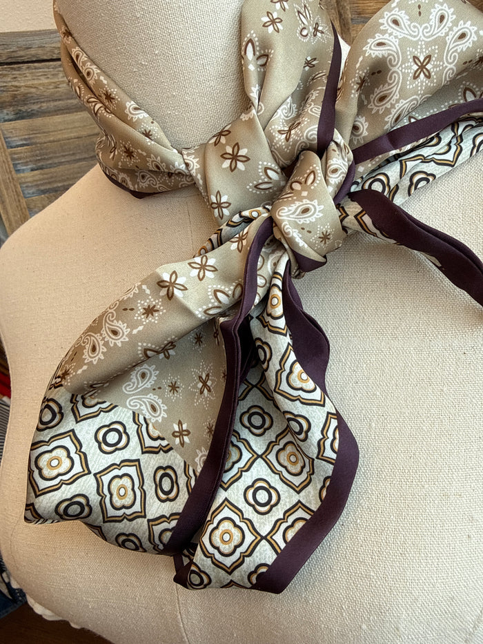 Paisley twilly scarf close-up in chocolate tan, knotted and draped