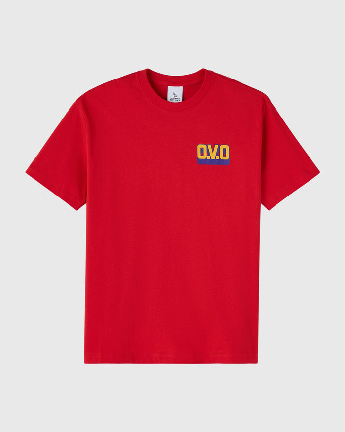 Red t-shirt with multicolored "OVO" wordmark print on chest.