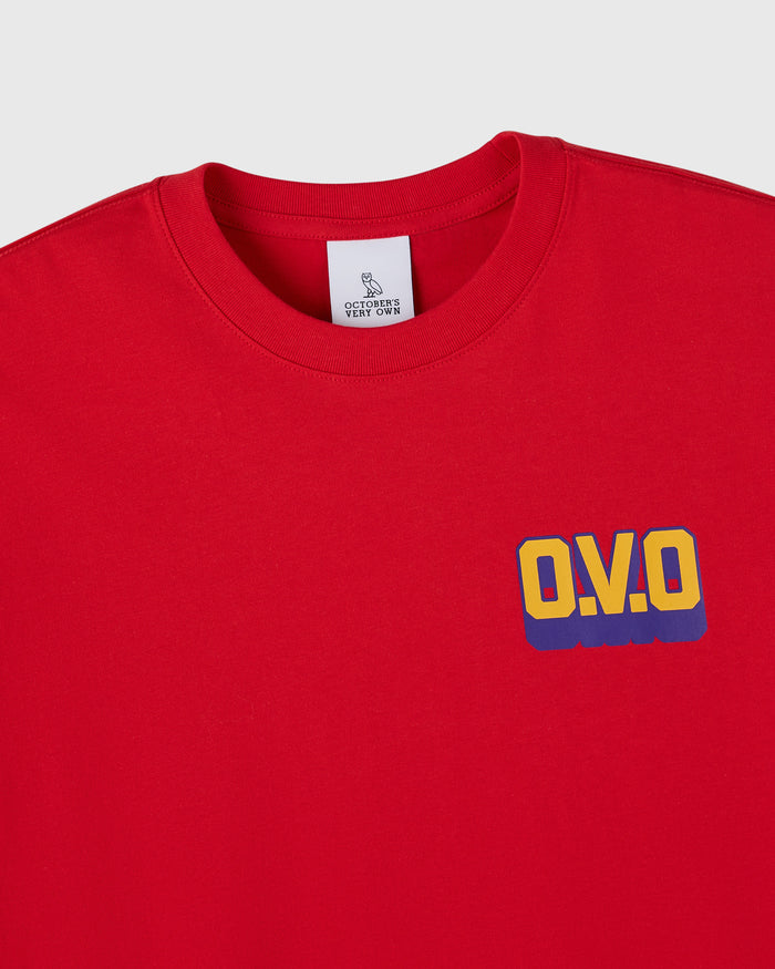 Red crewneck t-shirt with yellow and blue "O.V.O" wordmark graphic on chest.