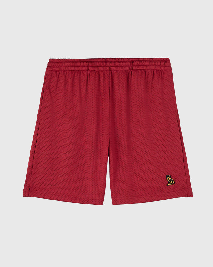 Red mesh shorts with elastic waistband and small owl logo embroidered on right leg.